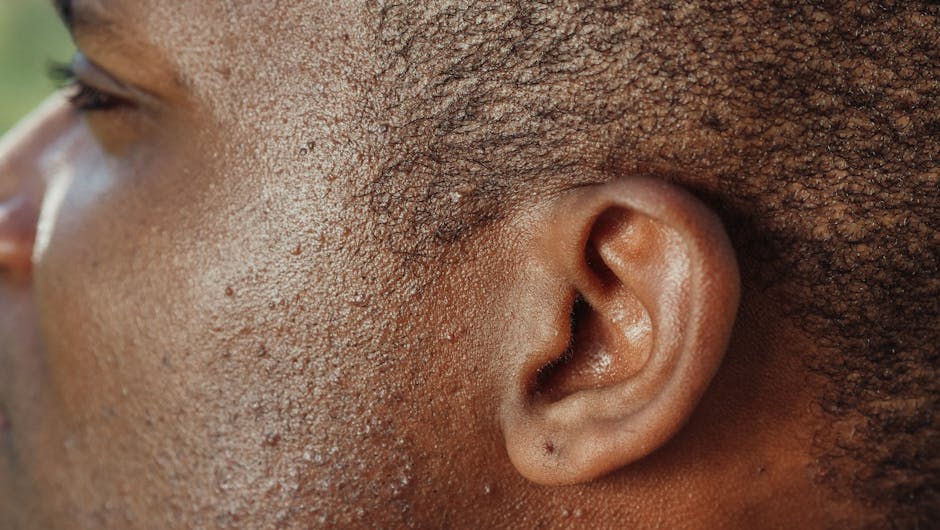 Detailed close-up image highlighting the texture of human skin and ear.