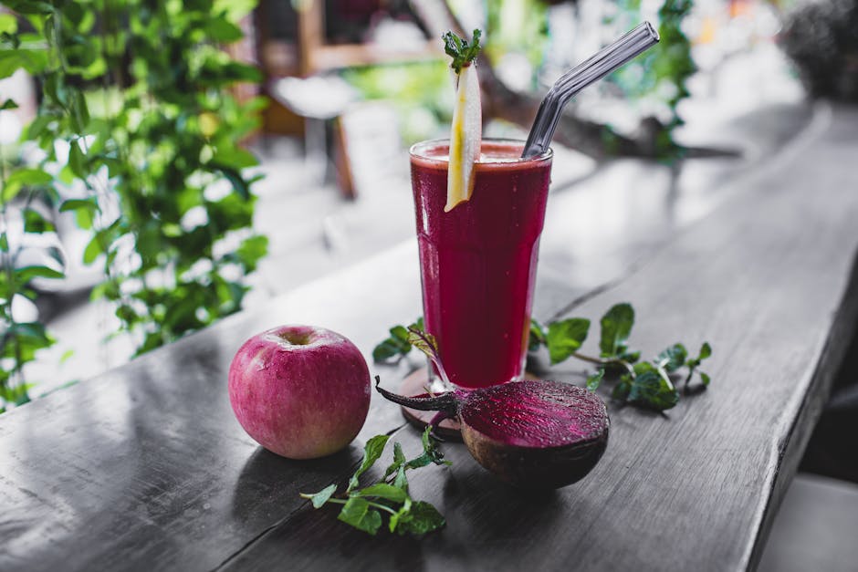 Refreshing beetroot and apple juice garnished with mint leaves, perfect for a healthy detox.