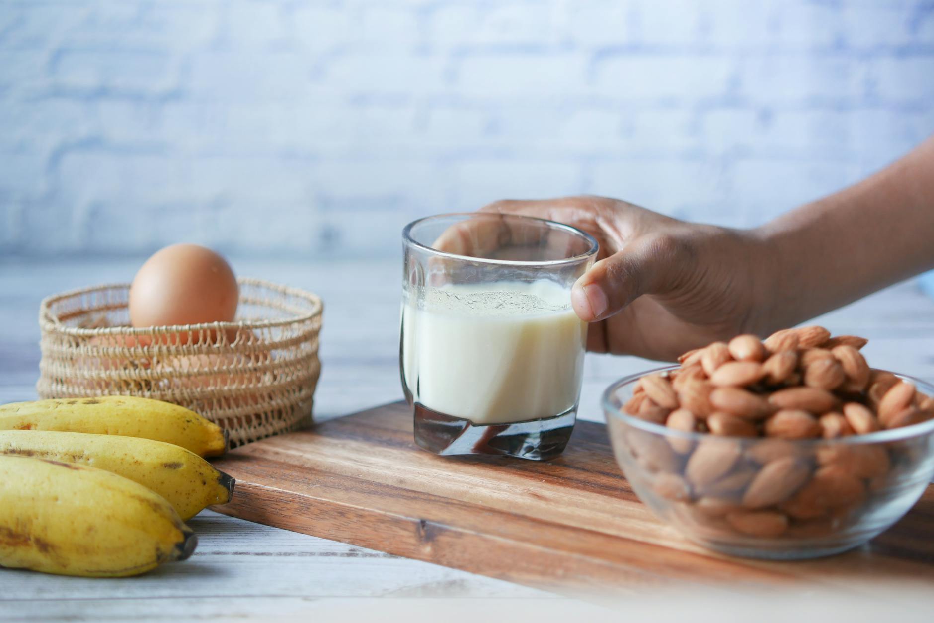 Calcium-rich foods including milk, almonds, banana, and eggs for bone health