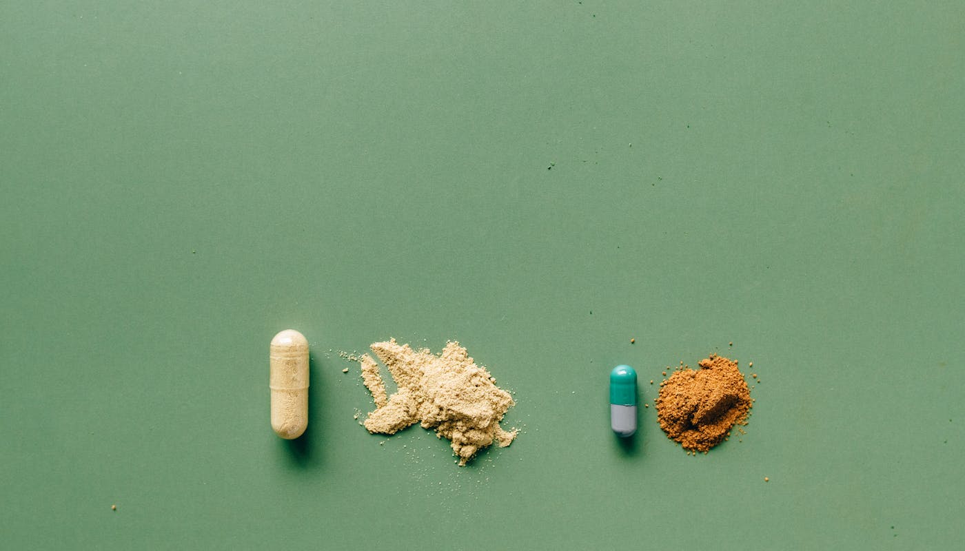 Various supplement capsules and natural health remedies representing NAC and brain health supplements