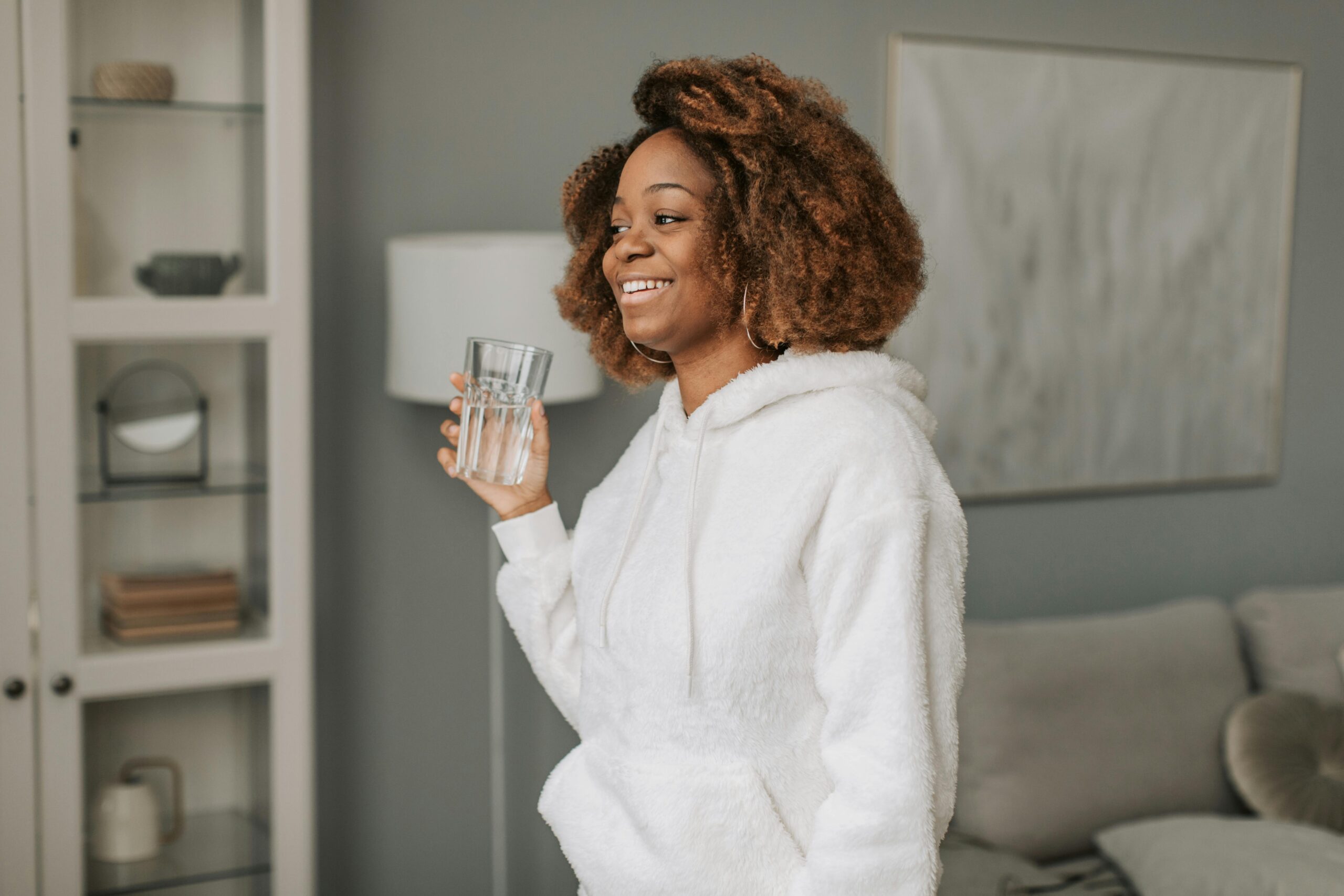 Woman drinking water in the morning